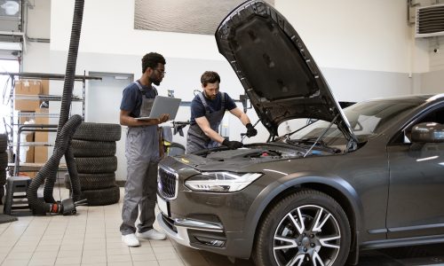 Mechanics,Working,On,Car,Maintenance,In,Modern,Auto,Repair,Shop, Mechanics,Working,On,Car,Maintenance,In,Modern,Auto,Repair,Shop,